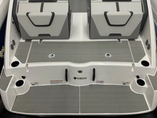 Slide: The Image of 2025 Yamaha Boats AR220 deck with sleek seating and modern design. - 17