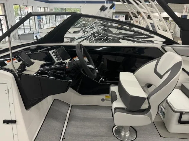 Slide: The Image of 2025 Yamaha Boats AR220 cockpit with modern steering and seating. - 6