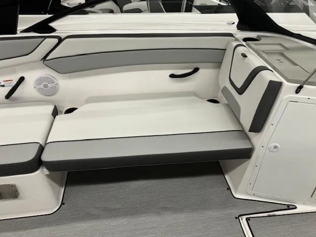 Slide: The Image of 2025 Yamaha Boats AR220 interior seating with gray and white upholstery. - 9
