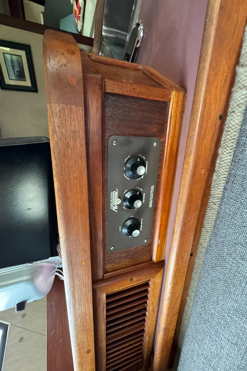 Slide: The Image of 1986 Carver Mariner 3297 interior with vintage control panel and wooden accents. - 12