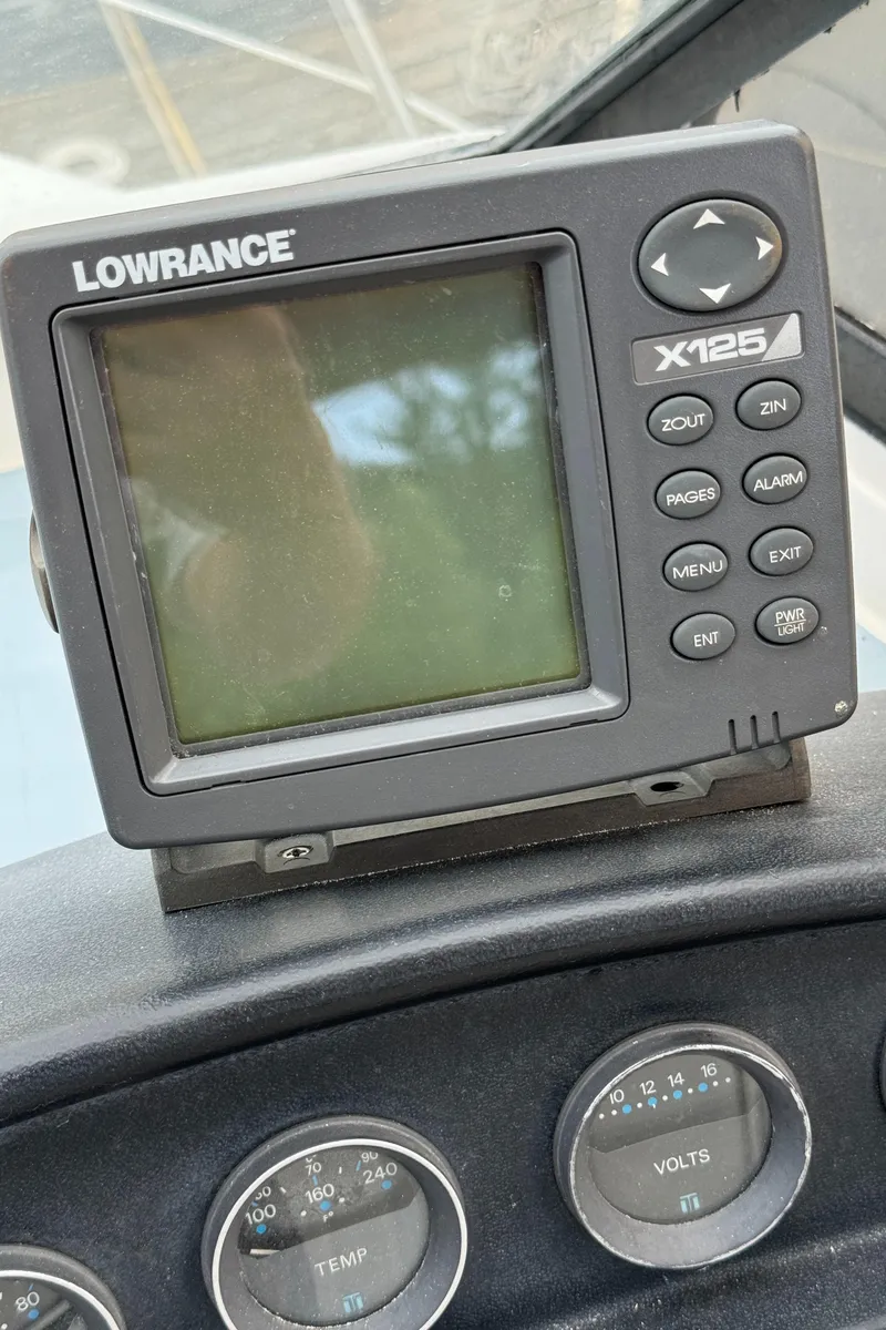 Slide: The Image of Lowrance X125 fishfinder on 1986 Carver Mariner 3297 dashboard. - 16