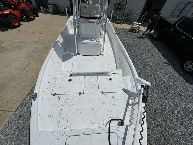 Slide: The Image of 2023 Blazer Bay 2400 boat with white deck and modern design. - 14