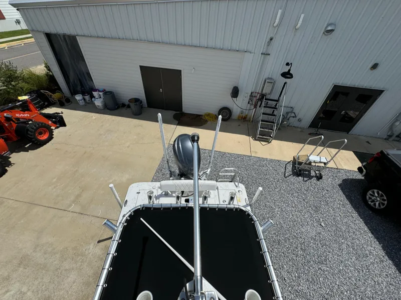 Slide: The Image of Overhead view of a 2023 Blazer Bay 2400 boat near a building and equipment. - 31
