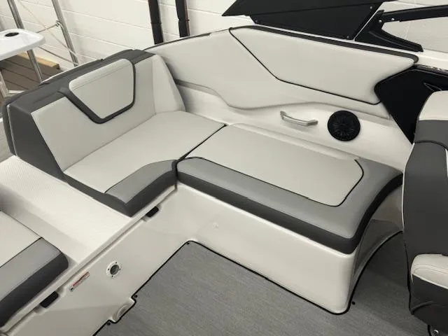 Slide: The Image of 2025 Yamaha AR250 boat interior with sleek gray and white seating. - 12