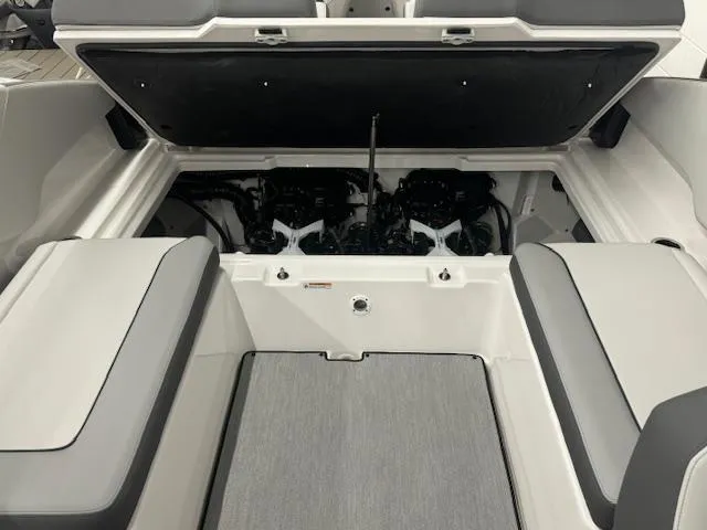 Slide: The Image of 2025 Yamaha AR250 boat engine compartment with open hatch and seating area. - 15
