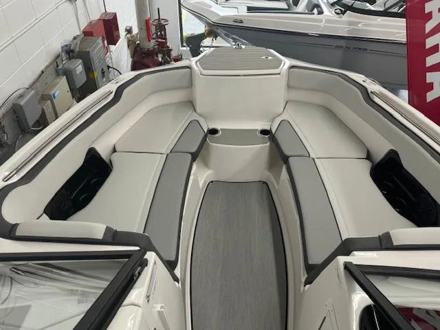 Slide: The Image of 2025 Yamaha Boats AR250 interior with sleek seating and modern design. - 2