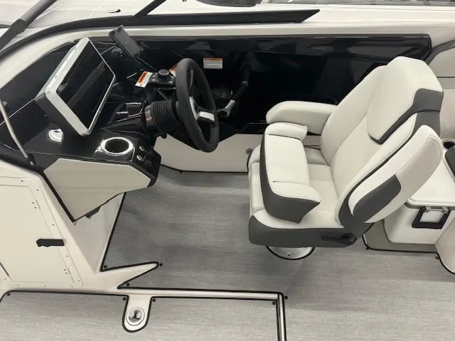 Slide: The Image of 2025 Yamaha Boats AR250 cockpit with modern steering and comfortable seating. - 6