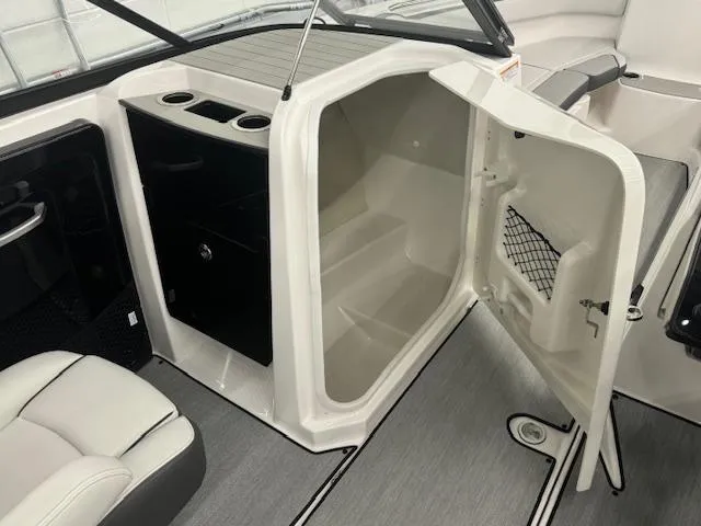 Slide: The Image of 2025 Yamaha AR250 boat interior with open storage compartment and seating area. - 9