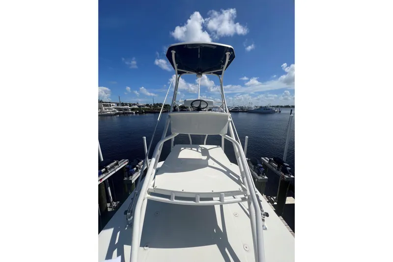Slide: The Image of 2015 HCB 42 Siesta boat docked under clear blue sky. - 16