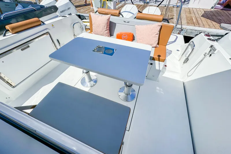 Slide: The Image of Interior of Beneteau Flyer 9 SPACEdeck 2026 with table and seating. - 7