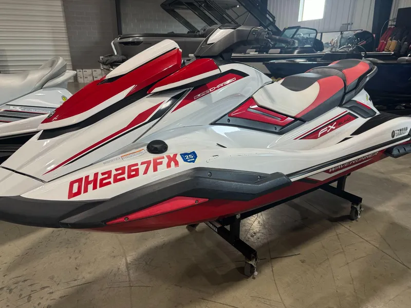 Slide: The Image of 2019 Yamaha WaveRunner FX SVHO in red and white, displayed indoors. - 2