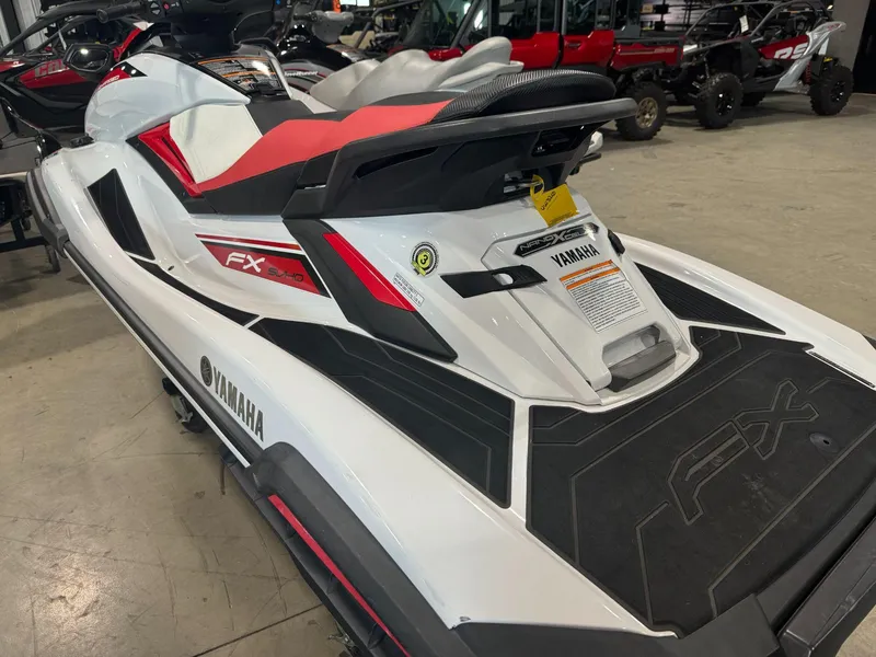 Slide: The Image of 2019 Yamaha WaveRunner FX SVHO in showroom, white and red design, rear view. - 3