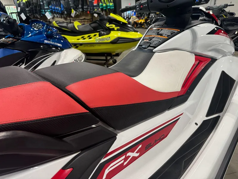 Slide: The Image of 2019 Yamaha WaveRunner FX SVHO with red and black seat in showroom. - 5