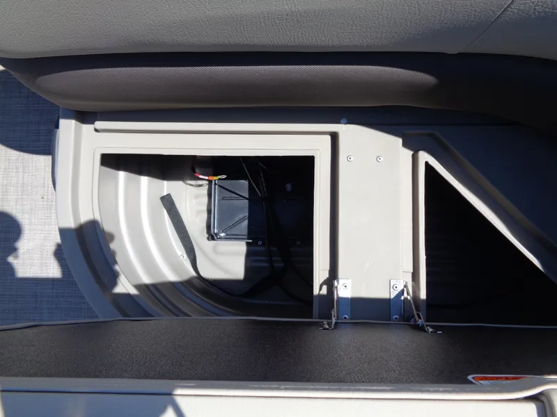 Slide: The Image of 2025 Sun Tracker Bass Buggy 16 XL Select storage compartment with wiring. - 10
