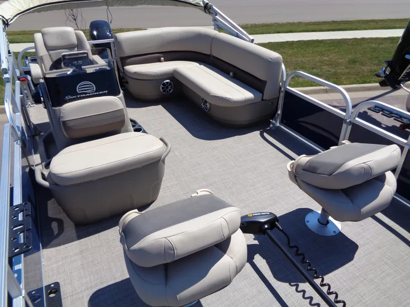 Slide: The Image of 2025 Sun Tracker Bass Buggy 16 XL Select pontoon boat interior with seating and controls. - 12