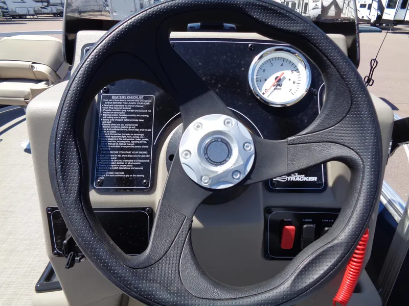 Slide: The Image of Steering wheel of 2025 Sun Tracker Bass Buggy 16 XL Select boat. - 4