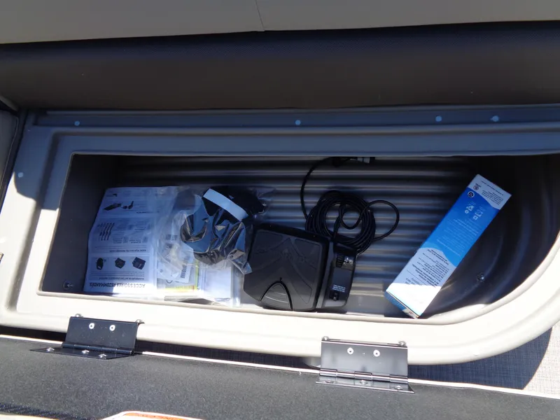 Slide: The Image of Storage compartment of 2025 Sun Tracker Bass Buggy 16 XL Select with accessories. - 9