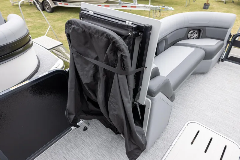 Slide: The Image of 2025 Premier 250 Solaris RF boat interior with foldable seat and storage compartment. - 15