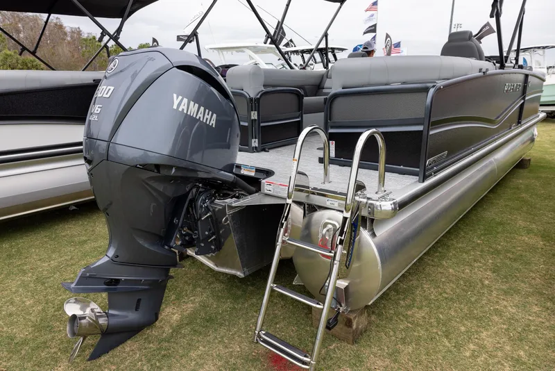 Slide: The Image of 2025 Premier 250 Solaris RF pontoon boat with Yamaha outboard motor. - 2