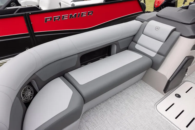 Slide: The Image of 2025 Premier 250 Solaris RF boat interior with gray seating and red exterior detailing. - 4