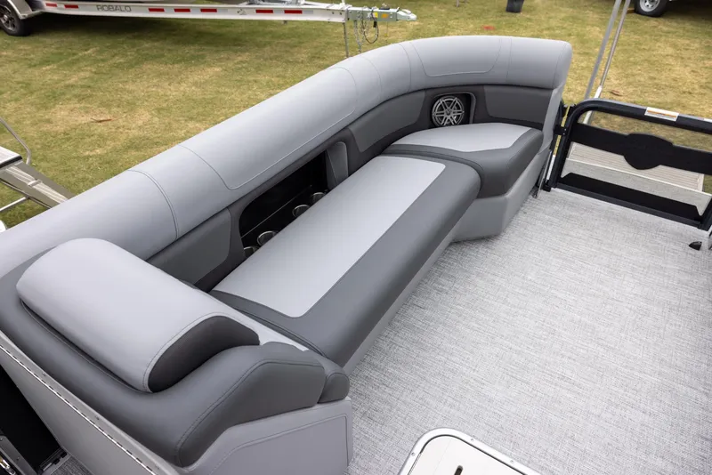 Slide: The Image of 2025 Premier 250 Solaris RF boat interior with gray seating and speaker system. - 6