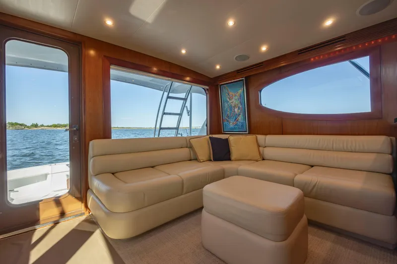 Slide: The Image of Luxurious interior of 2005 Hatteras 54 Convertible yacht with beige leather seating. - 11