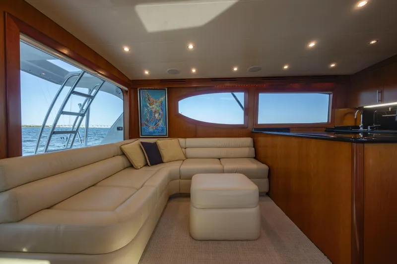 Slide: The Image of Luxurious interior of 2005 Hatteras 54 Convertible yacht with plush seating and ocean view. - 13