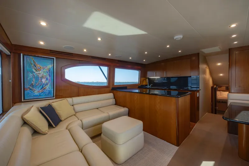 Slide: The Image of Luxurious interior of 2005 Hatteras 54 Convertible yacht with plush seating and modern design. - 19