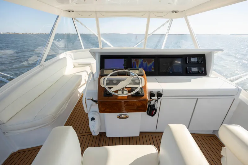Slide: The Image of Luxurious helm of 2005 Hatteras 54 Convertible yacht with modern navigation equipment. - 20