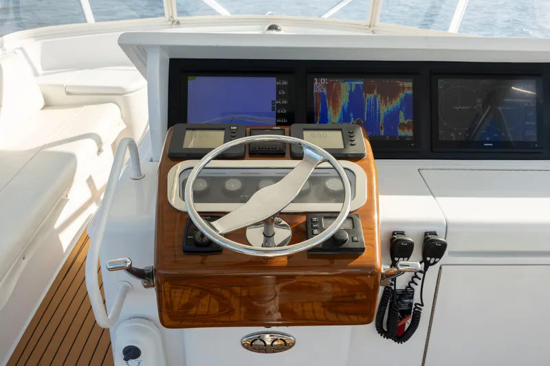 Slide: The Image of Steering console of 2005 Hatteras 54 Convertible yacht with navigation screens. - 21