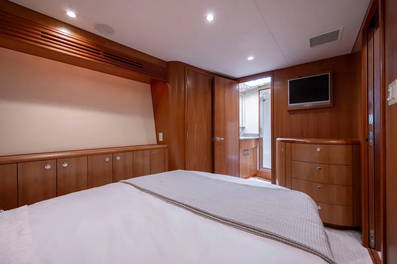 Slide: The Image of Luxurious cabin interior of 2005 Hatteras 54 Convertible yacht with wood paneling. - 26