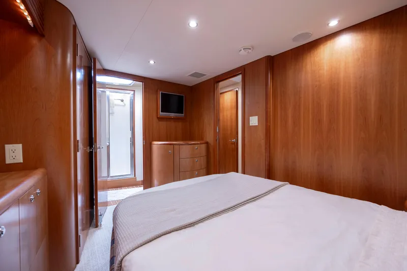 Slide: The Image of Luxurious cabin interior of 2005 Hatteras 54 Convertible yacht with wood paneling. - 27