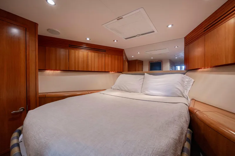 Slide: The Image of Luxurious cabin interior of 2005 Hatteras 54 Convertible yacht with wood paneling. - 32