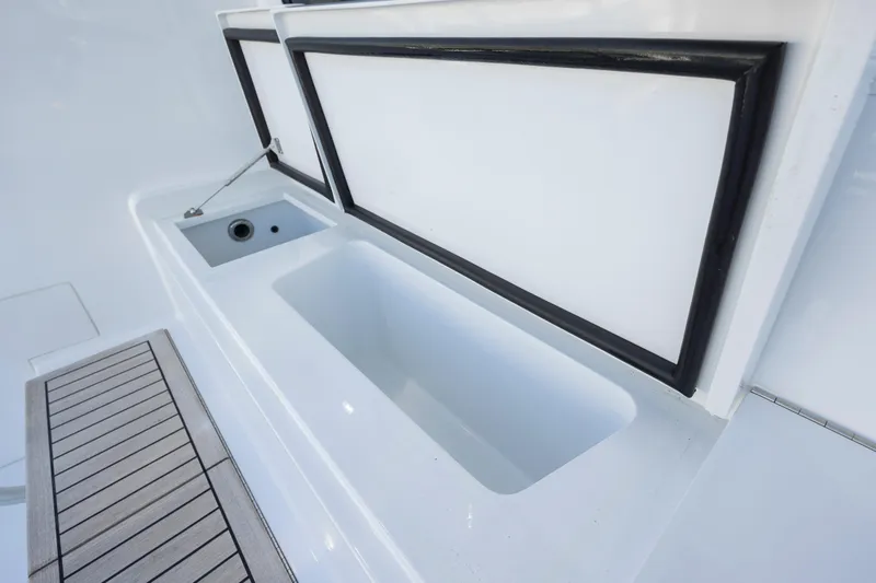 Slide: The Image of Hatteras 54 Convertible 2005 yacht interior detail with storage compartment and sink. - 9