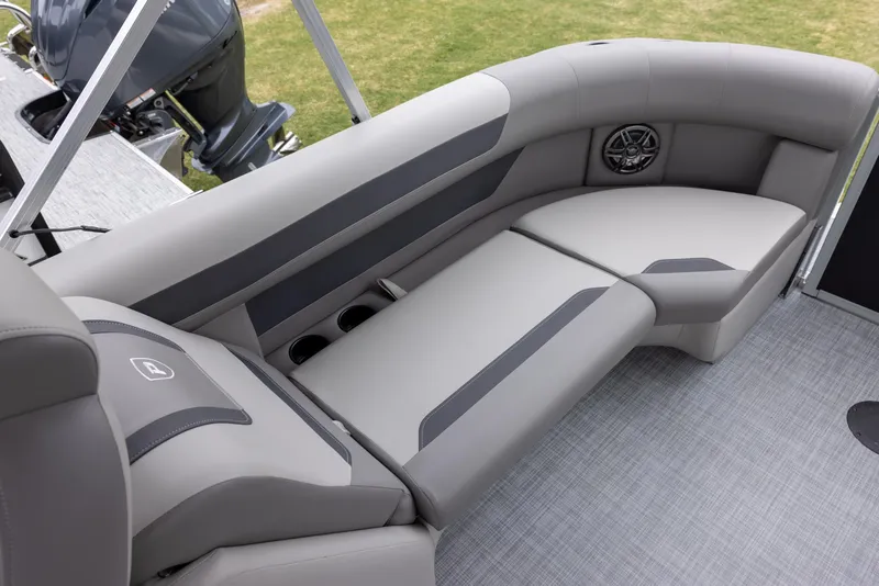 Slide: The Image of 2025 Premier 220 Sunscape RF boat interior with gray seating and cup holders. - 11