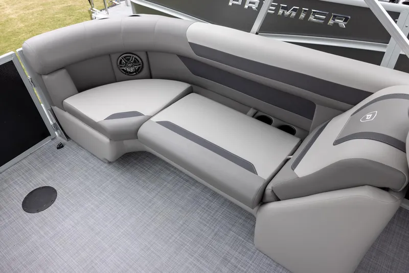 Slide: The Image of Luxurious seating on 2025 Premier 220 Sunscape RF boat, featuring sleek gray upholstery and integrated speaker. - 12
