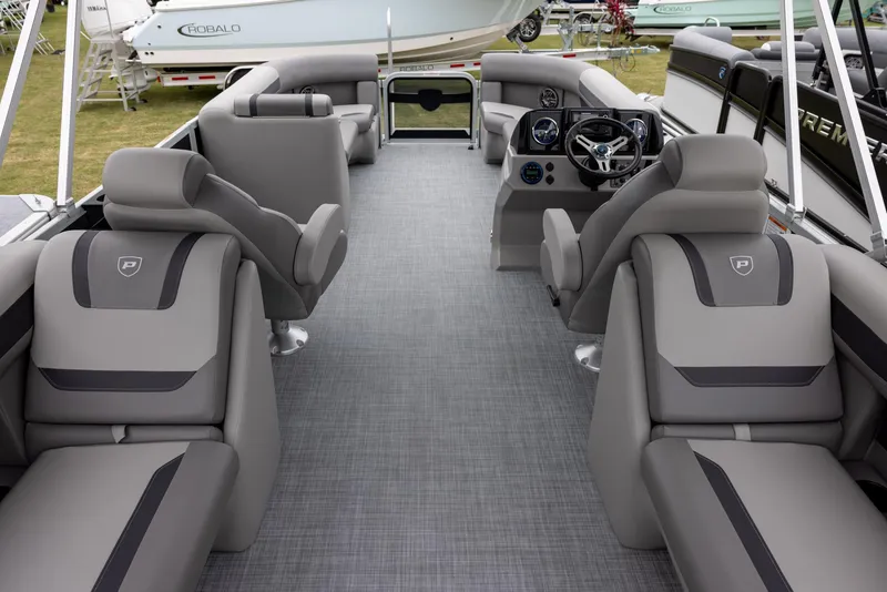 Slide: The Image of 2025 Premier 220 Sunscape RF boat interior with luxurious seating and modern dashboard. - 13