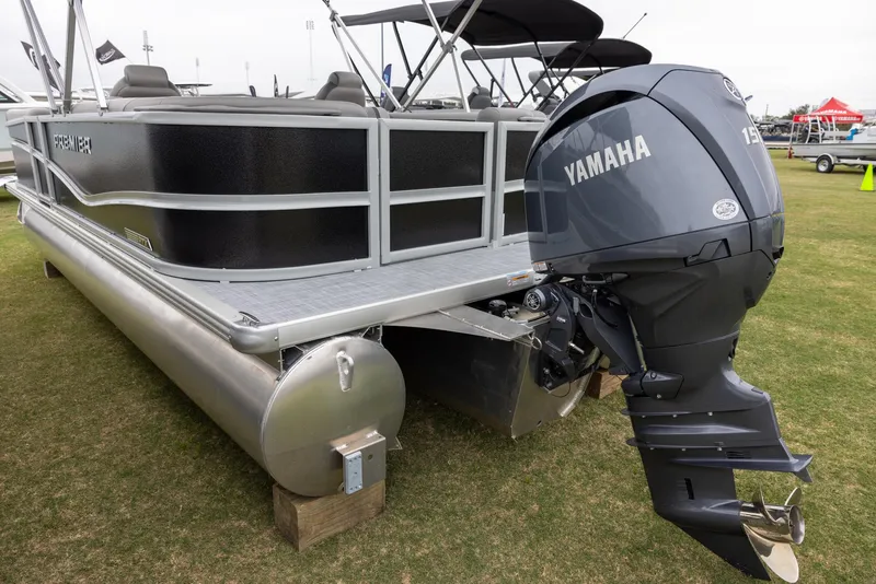 Slide: The Image of 2025 Premier 220 Sunscape RF pontoon boat with Yamaha outboard motor displayed on grass. - 3