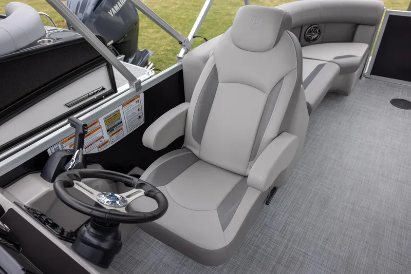 Slide: The Image of 2025 Premier 220 Sunscape RF boat interior with captain's chair and steering wheel. - 8
