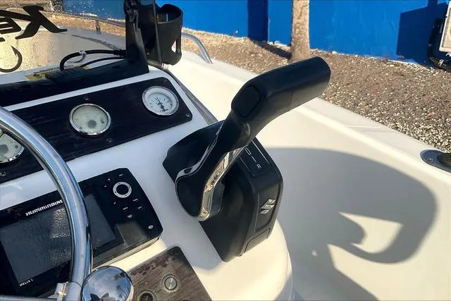 Slide: The Image of 2021 Key Largo 1800 CC boat dashboard with throttle and gauges. - 13