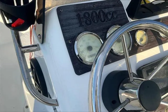 Slide: The Image of Steering wheel and dashboard of 2021 Key Largo 1800 CC boat. - 15