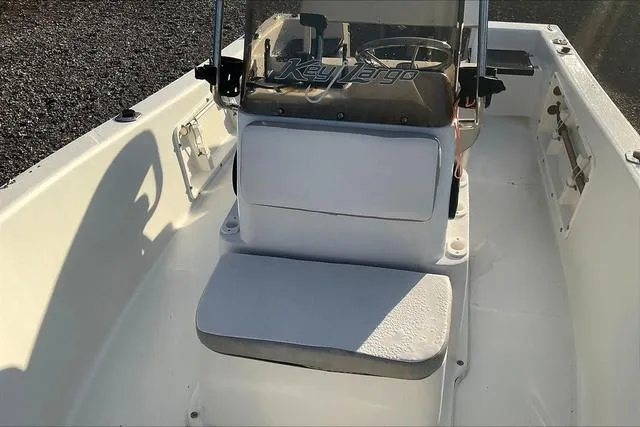 Slide: The Image of 2021 Key Largo 1800 CC boat interior with steering console and seating. - 19