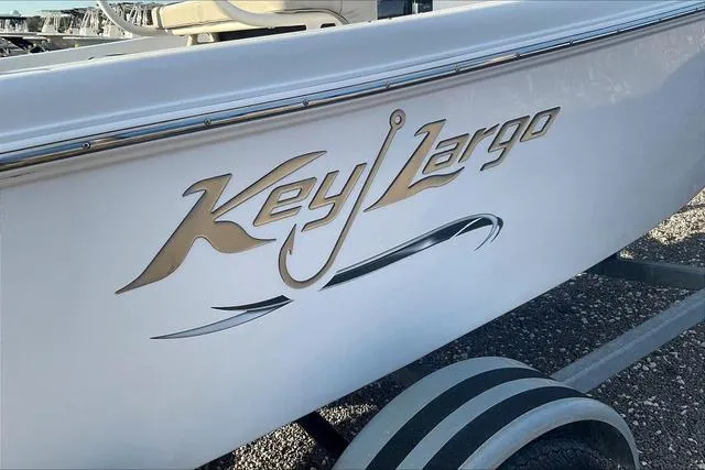 Slide: The Image of 2021 Key Largo 1800 CC boat logo on white hull. - 21