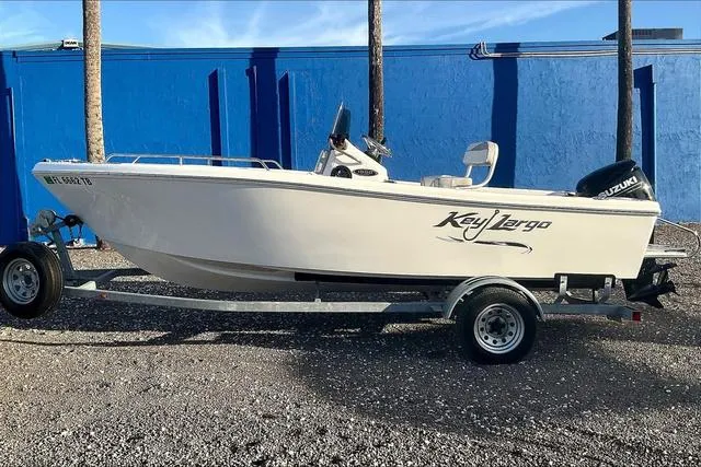 Slide: The Image of 2021 Key Largo 1800 CC boat on trailer, displayed outdoors. - 3