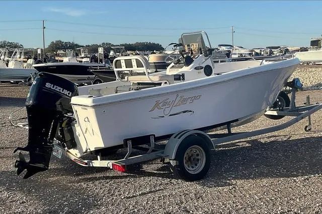 Slide: The Image of 2021 Key Largo 1800 CC boat on trailer with Suzuki outboard motor. - 6