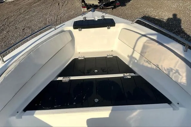 Slide: The Image of 2021 Key Largo 1800 CC boat interior with seating and storage compartments. - 9