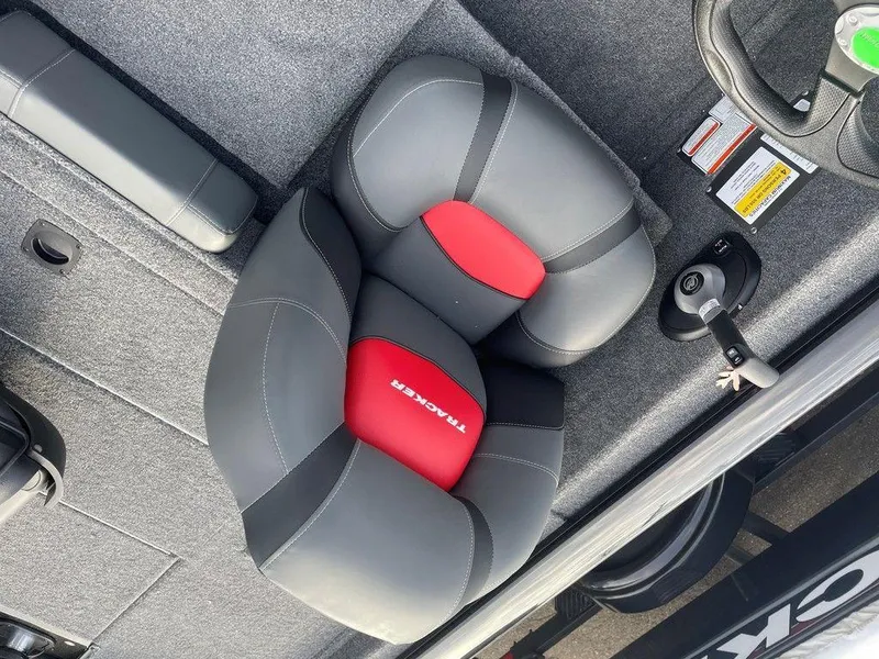 Slide: The Image of 2025 Tracker Pro Team 175 TXW® boat seat, gray and red design, top view. - 11