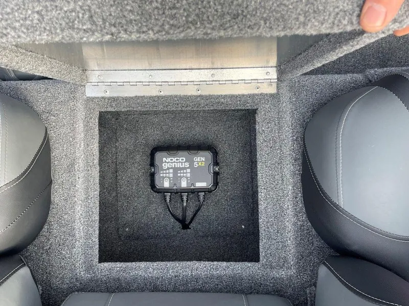 Slide: The Image of 2025 Tracker Pro Team 175 TXW® boat battery compartment with NOCO Genius GEN5X charger. - 13
