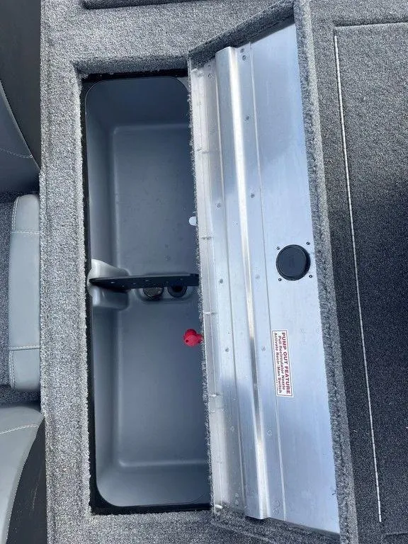 Slide: The Image of 2025 Tracker Pro Team 175 TXW® boat storage compartment, open and empty. - 14