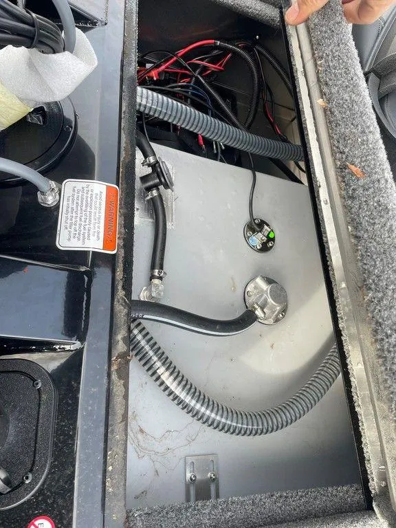 Slide: The Image of 2025 Tracker Pro Team 175 TXW® boat wiring and fuel compartment. - 16